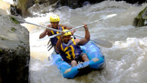 Adventurers kayaking through the challenging rapids of Ayung River in Ubud with Mason Adventure Rafting