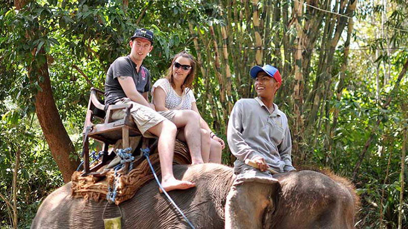 Tourists enjoy the Bali Elephant Park Bakas Adventure