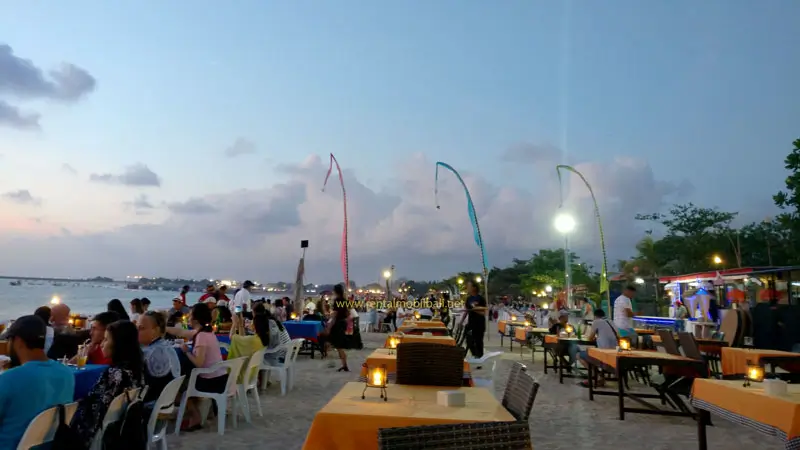 Dinner at Jimbaran beachside cafe with grilled seafood dishes, one of the 3-Day Jimbaran Itinerary