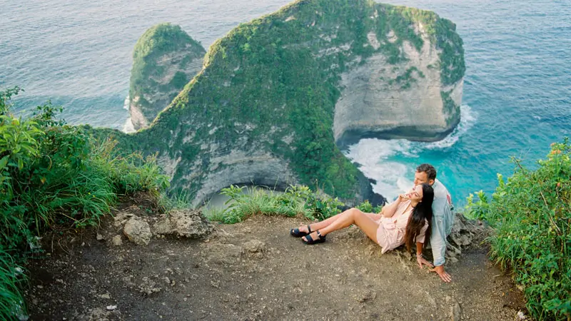 Romantic view at Kelingking Beach, Nusa Penida during Bali honeymoon.