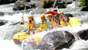 Tourists rafting through Bali's scenic river rapids.