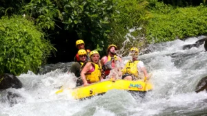 Group of rafters enjoying a whitewater rafting adventure in Bali.