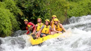 Group rafting adventure in Bali with safety gear, showcasing outdoor activities and thrill-seeking fun.