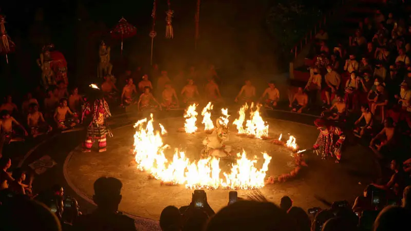 Kecak night fire performance with dancers in a circle of flames.