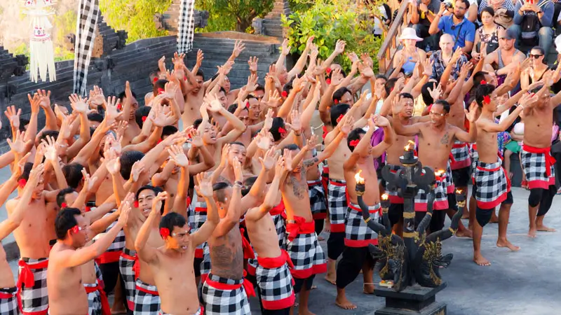 Kecak performers in sacred formation during sunset.