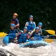 Exciting whitewater rafting adventure on the Ayung River in Bali, featuring a group of tourists navigating rapids with joy and enthusiasm.